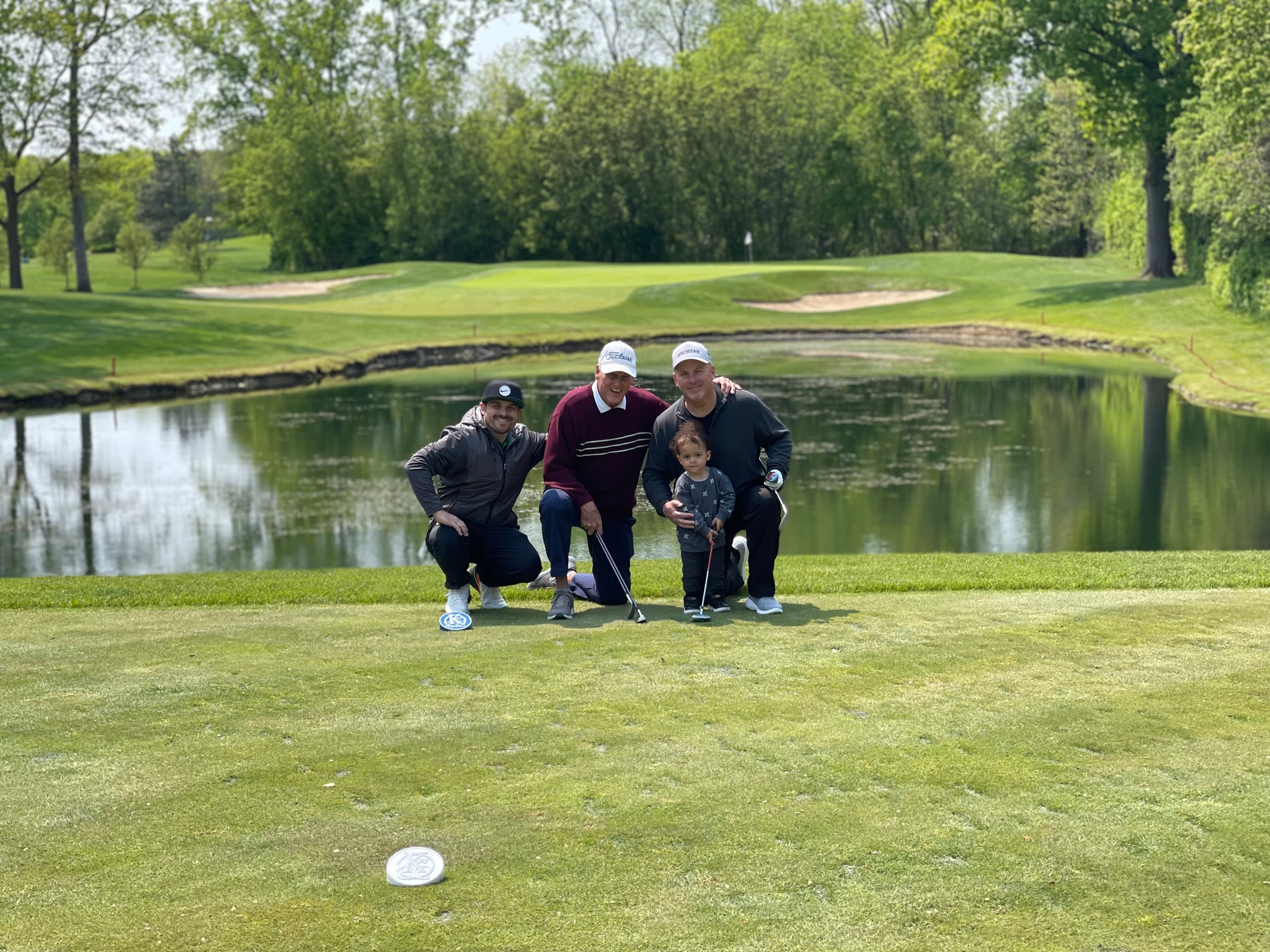 Clint Johnson with family on a golf course tee box in Bloomfield Hills, Michigan, 2024